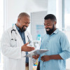 smiling doctor and patient african american