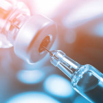 syringe in vial vaccine
