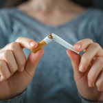 hands break cigarette quite smoking