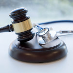 Gavel and stethoscope. medical jurisprudence. legal definition of medical malpractice. attorney. common errors doctors, nurses and hospitals make