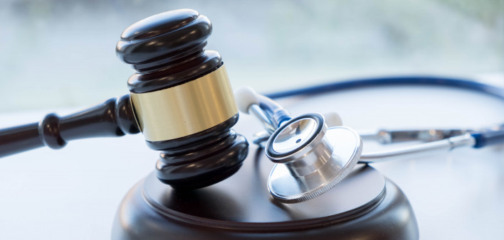 Gavel and stethoscope. medical jurisprudence. legal definition of medical malpractice. attorney. common errors doctors, nurses and hospitals make