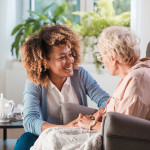 caregiver and elderly woman patient, nurse