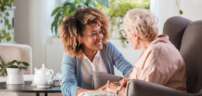 caregiver and elderly woman patient, nurse