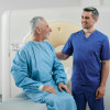 A radiographer prepares a patient for his CT scan.