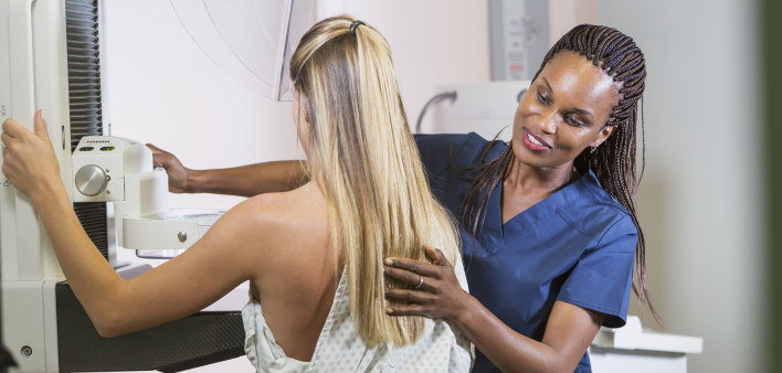 Woman getting mammogram