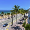 Sunrise Beach in Ft.Lauderdale with palm trees and beach entry feature.