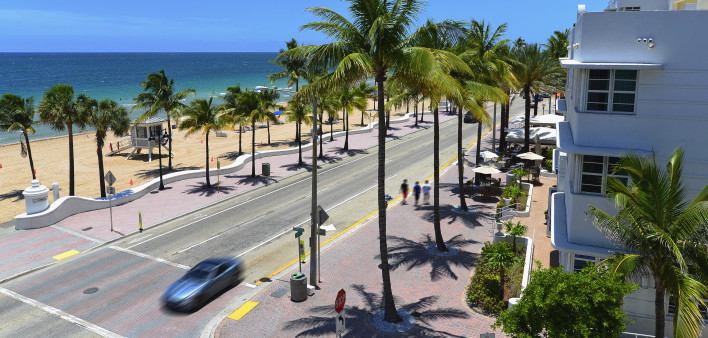 Sunrise Beach in Ft.Lauderdale with palm trees and beach entry feature.