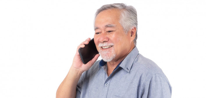 older man talking on the phone