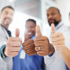 doctors, nurses and patient giving thumbs up