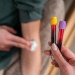Female nurse holding blood collection tubes stock photo Blood Donation, Blood Test, Medical Test, Patient,