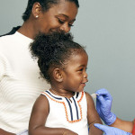 little girl and mother vaccine