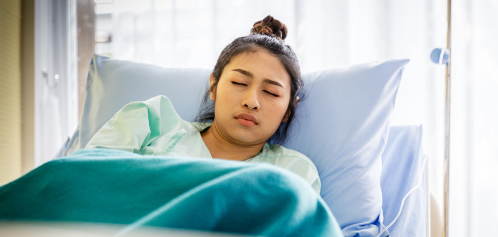 Patient with illness in hospital room