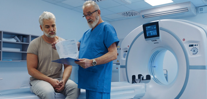 A doctor explains CT scan results.