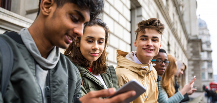 Teenagers students using smartphone on a school break