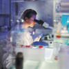 woman researcher in lab microscope