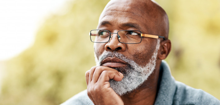 senior man outdoors thinking