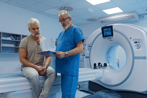 A doctor explains CT scan results.