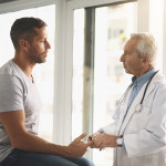 Cropped shot of a senior doctor giving his male patient a thorough checkup during his consultation