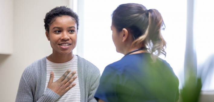 young woman taking to her doctor