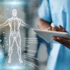 healthcare worker using an ipad and illustration of human body projected