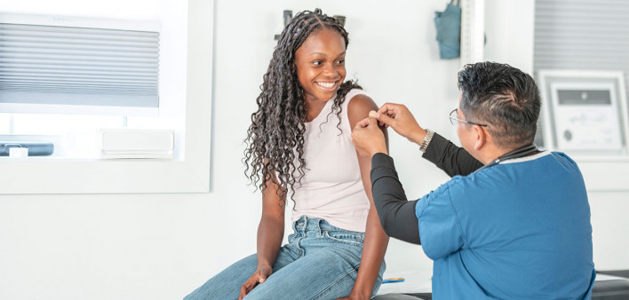 young girl getting vaccine