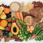 food with high fiber content for a healthy diet with fruit, vegetables, whole wheat bread, pasta, nuts, legumes, grains and cereals
