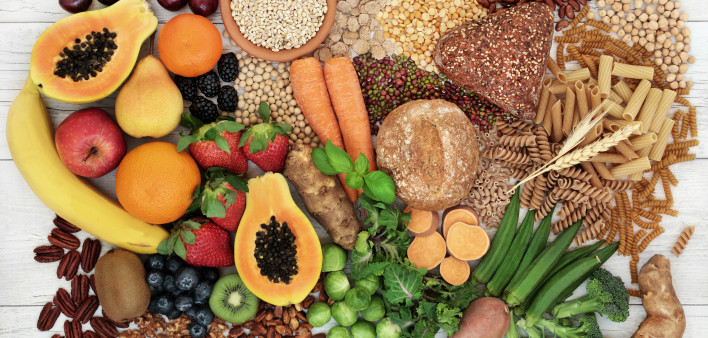 food with high fiber content for a healthy diet with fruit, vegetables, whole wheat bread, pasta, nuts, legumes, grains and cereals