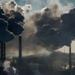 Ecological catastrophy smokestacks billowing smoke