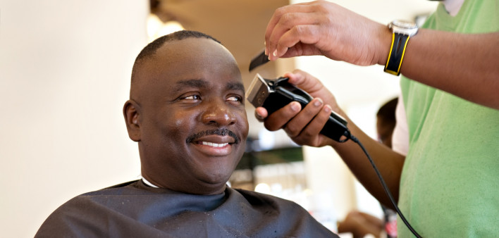 African American Barber Shop Smile man getting hair cut