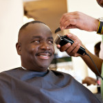 African American Barber Shop Smile man getting hair cut