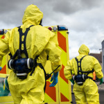 Biohazard team of emergency medical service in protective suits
