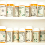 pill bottles with money as labels cost of healthcare