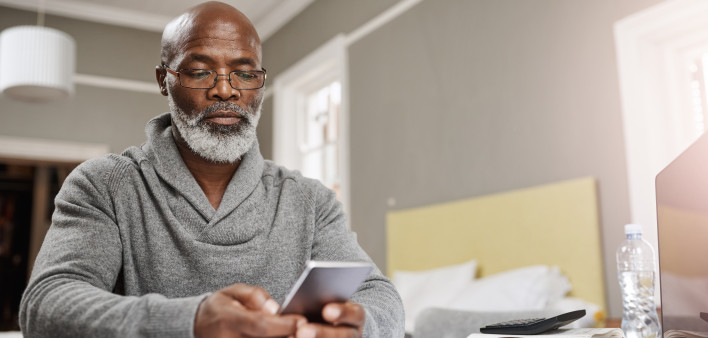 Smart apps make for smart budgeting senior black man with phone