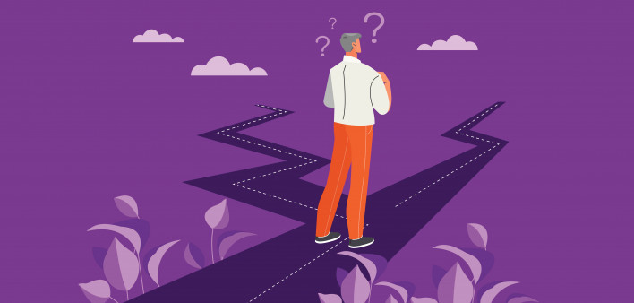 Businessman with two roads. Man evaluates both options.