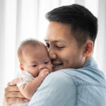 man and baby father holding baby