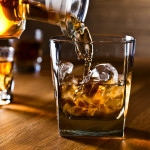 whiskey and natural ice on old wooden table