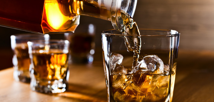whiskey and natural ice on old wooden table