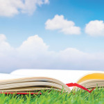 open book grass blue sky