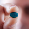 Young man with a PrEP pill