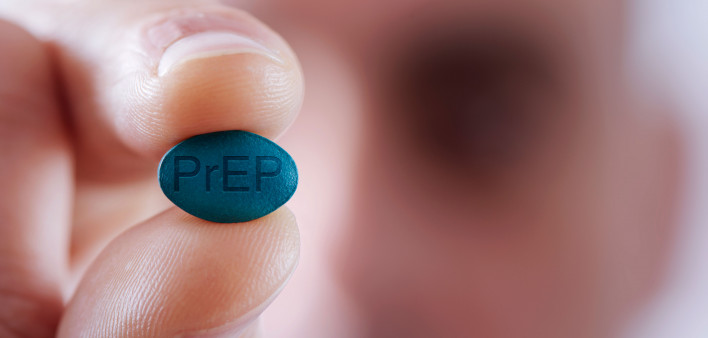 Young man with a PrEP pill
