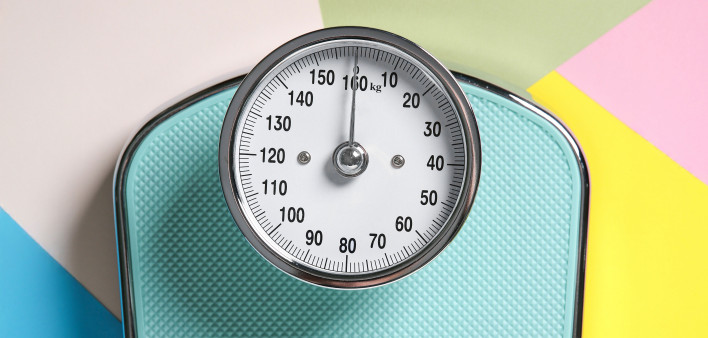 One bathroom scale on color background, top view