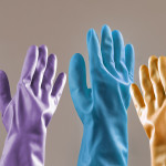 Migrant votes. Doctors voting. Healthcare system in elections. Hands of housewife in protective rubber gloves