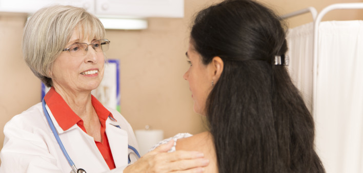 Mid-adult, latin descent woman receiving her annual breast exam from her gynocologist doctor at hospital or clinic. Senior adult, female doctor. Women's health, issues. Breast cancer awareness. (75 kB)