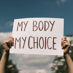 Woman holding a sign My Body, My Choice