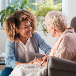 caregiver and elderly woman patient, nurse