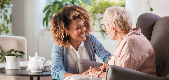 caregiver and elderly woman patient, nurse