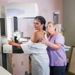 african american woman getting a mammogram