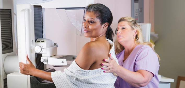 african american woman getting a mammogram
