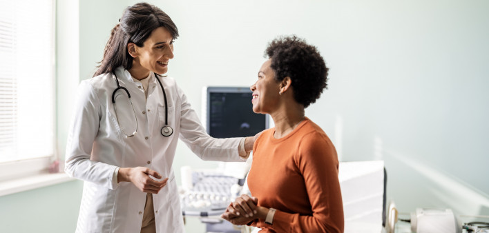 Female medical practitioner reassuring a patient