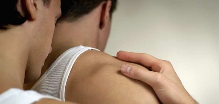 One gay man holding another